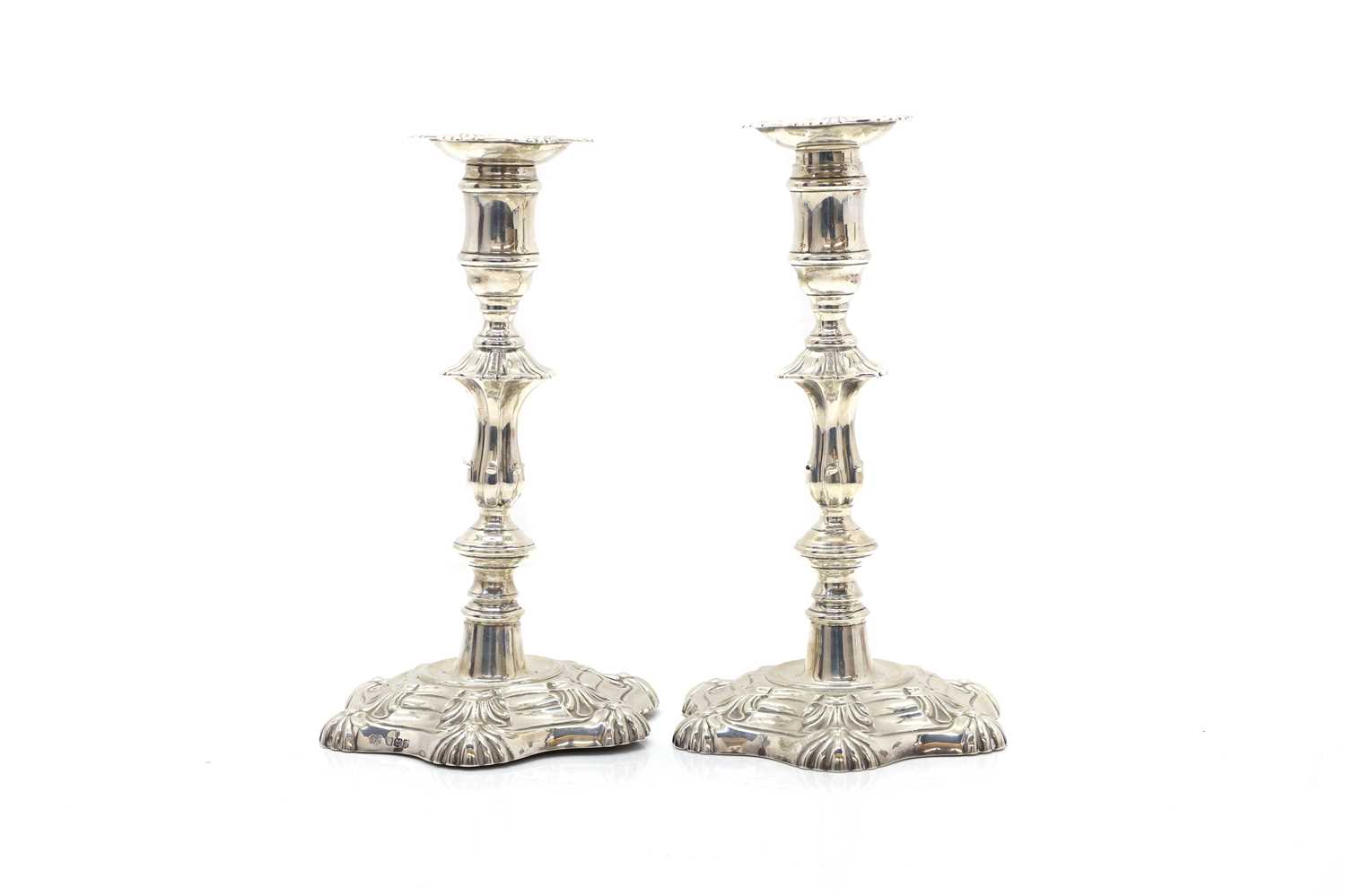 Lot 11 - A pair of silver candlesticks