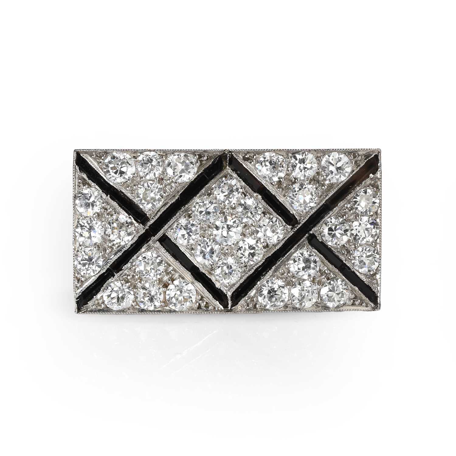 Lot 53 - An Art Deco onyx and diamond plaque brooch