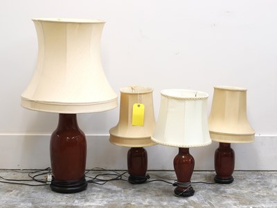 Lot 471 - A pair of sang de boeuf table lamps