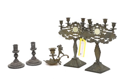 Lot 52 - A pair of Chinese brass candlebra