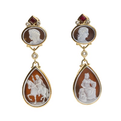 Lot 150 - A pair of gold, shell cameo, ruby and diamond pendant earrings, by Angela Puttini