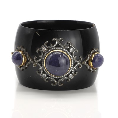 Lot 165 - A gemstone and diamond set black resin bangle
