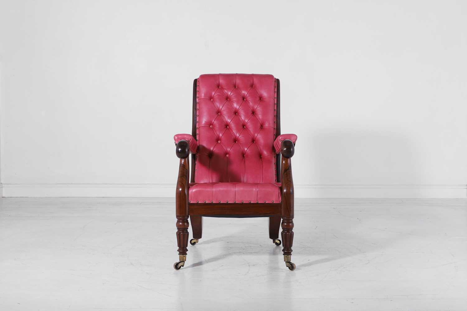 Lot 275 - A George IV rosewood library armchair