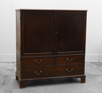 Lot 507 - A George III mahogany linen press of diminutive size