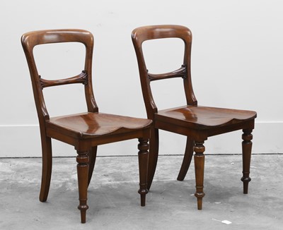 Lot 511 - A pair of mahogany hall chairs