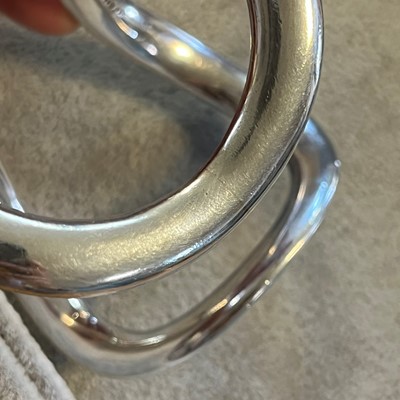 Lot 1117 - A silver bangle, by Hermès