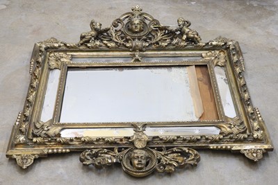 Lot 495 - A large giltwood overmantel mirror
