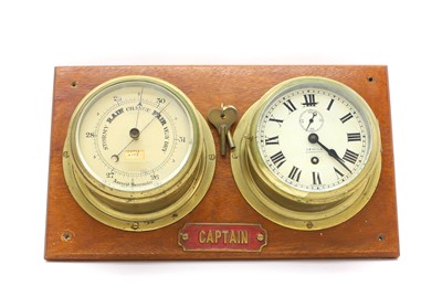 Lot 206 - A wall-mounted clock and an aneroid barometer