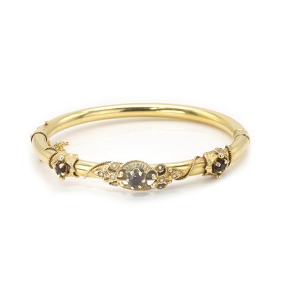 Lot 114 - A gold hinged bangle