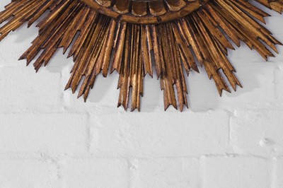 Lot 247 - A giltwood convex sunburst mirror