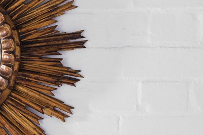 Lot 247 - A giltwood convex sunburst mirror