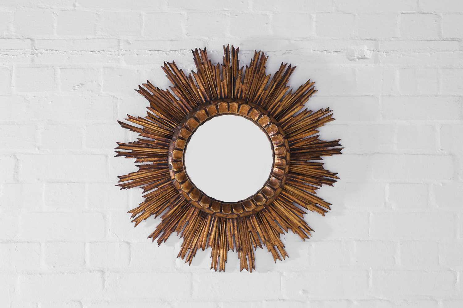 Lot 247 - A giltwood convex sunburst mirror