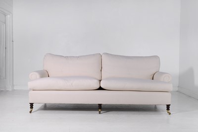 Lot 477 - An upholstered three-seater sofa by George Smith