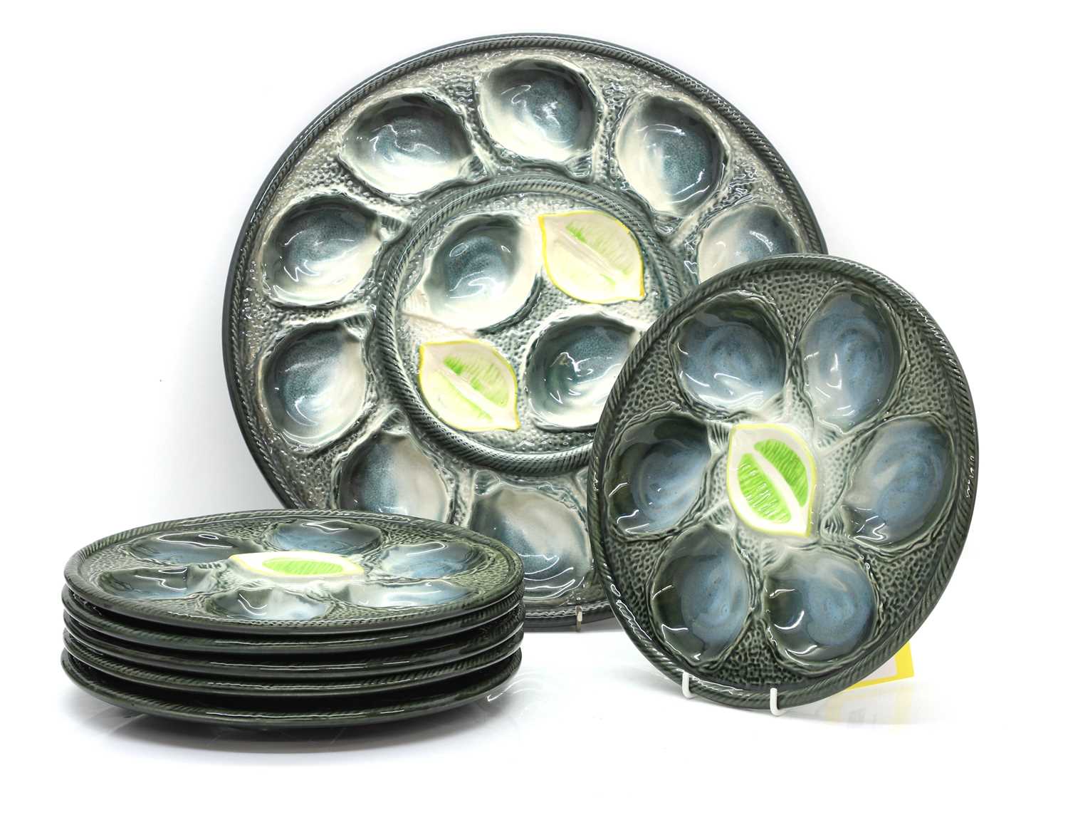 Lot 104 - A set of seven French St Clement oyster dishes