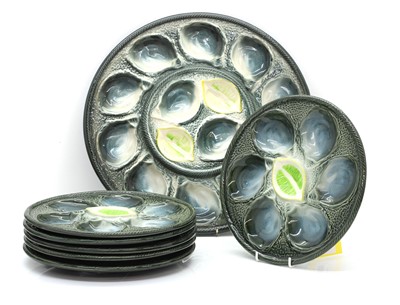 Lot 104A - A set of seven French St Clement oyster dishes