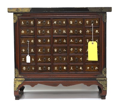 Lot 516 - A Chinese medicine cabinet