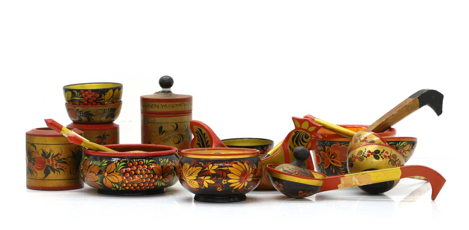 Lot 314 - A collection of Russian Khokhloma painted spoons and bowls