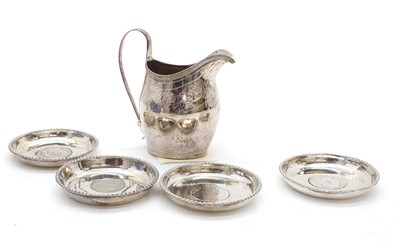 Lot 24 - A George III silver cream jug