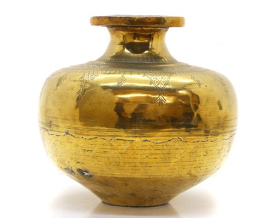 Lot 303 - A middle eastern brass vessel