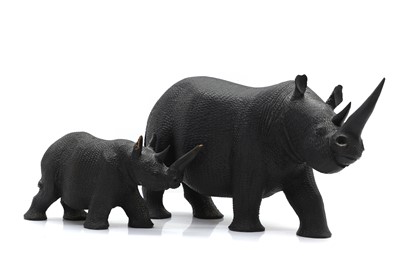 Lot 306 - Two carved hardwood rhinoceroses
