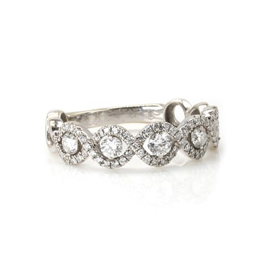 Lot 160 - A diamond wave design half eternity ring