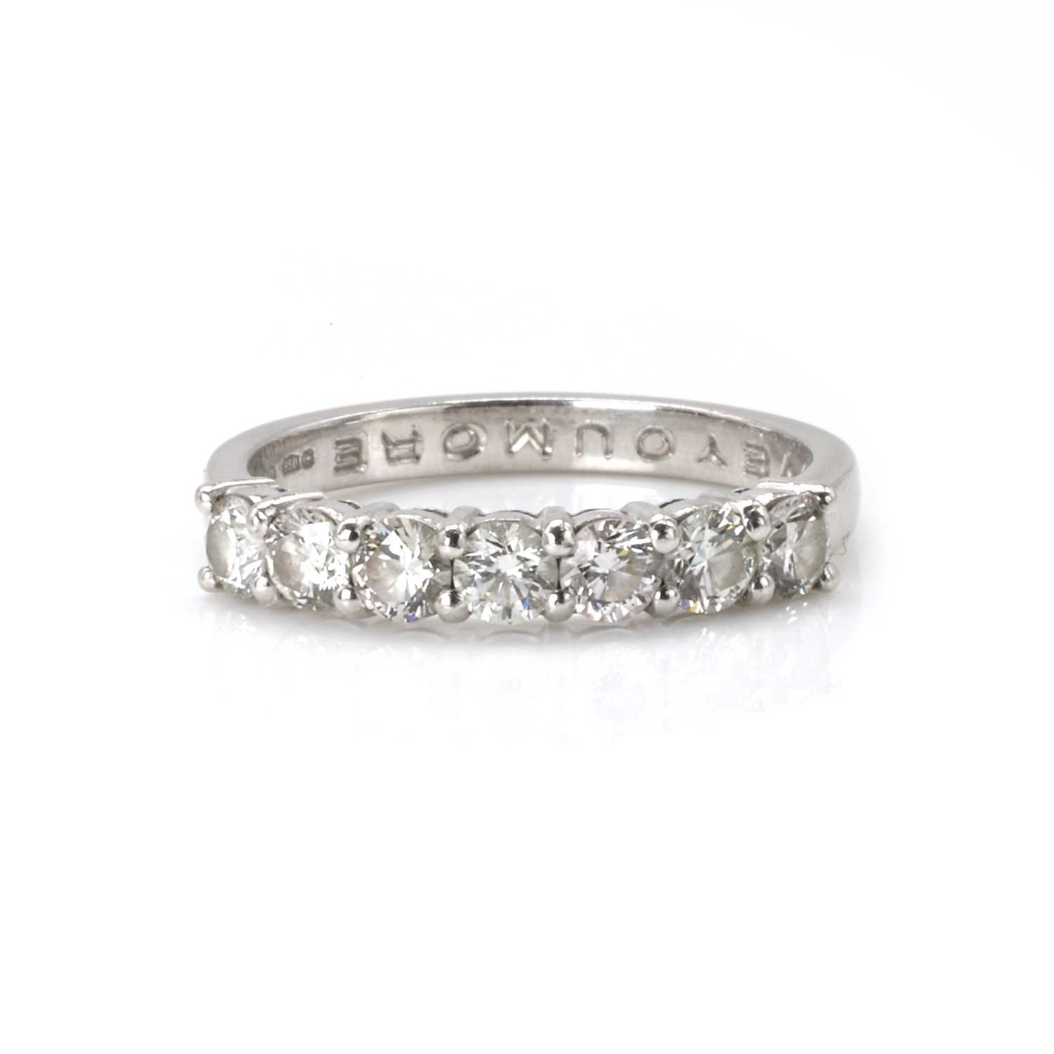 Lot 76 - A platinum and diamond half eternity ring