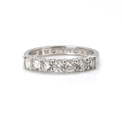 Lot 76 - A platinum and diamond half eternity ring