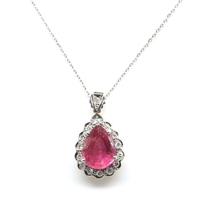 Lot 118 - A pink tourmaline and diamond pendant and chain