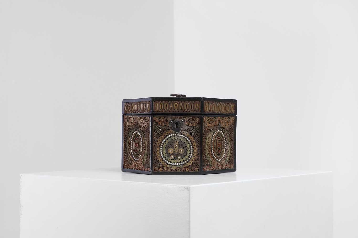 Lot 379 - A George III paper scroll tea caddy