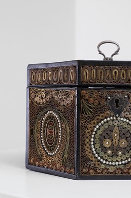 Lot 379 - A George III paper scroll tea caddy