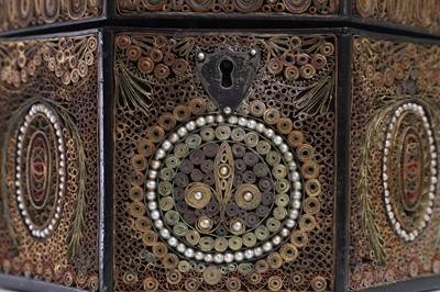 Lot 379 - A George III paper scroll tea caddy