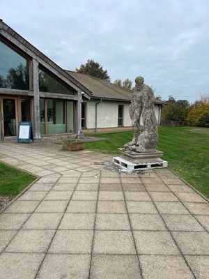 Lot 124 - A carved limestone statue after the antique