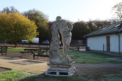 Lot 124 - A carved limestone statue after the antique