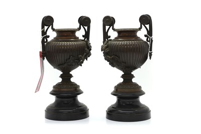 Lot 251 - A pair of bronze two handled garniture urns