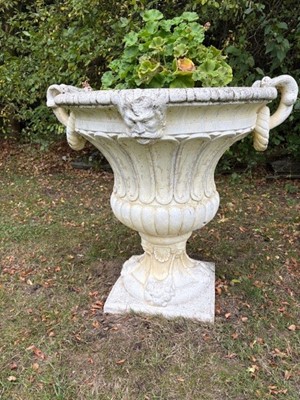 Lot 551 - A pair of composite garden urns