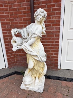 Lot 559 - A pair of reconstituted garden figures of ladies