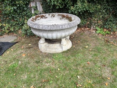 Lot 554 - A low reconstituted garden urn