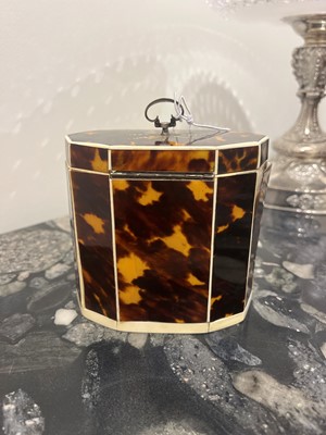Lot 388 - A George III tortoiseshell, ivory and mother-of-pearl inlaid tea caddy