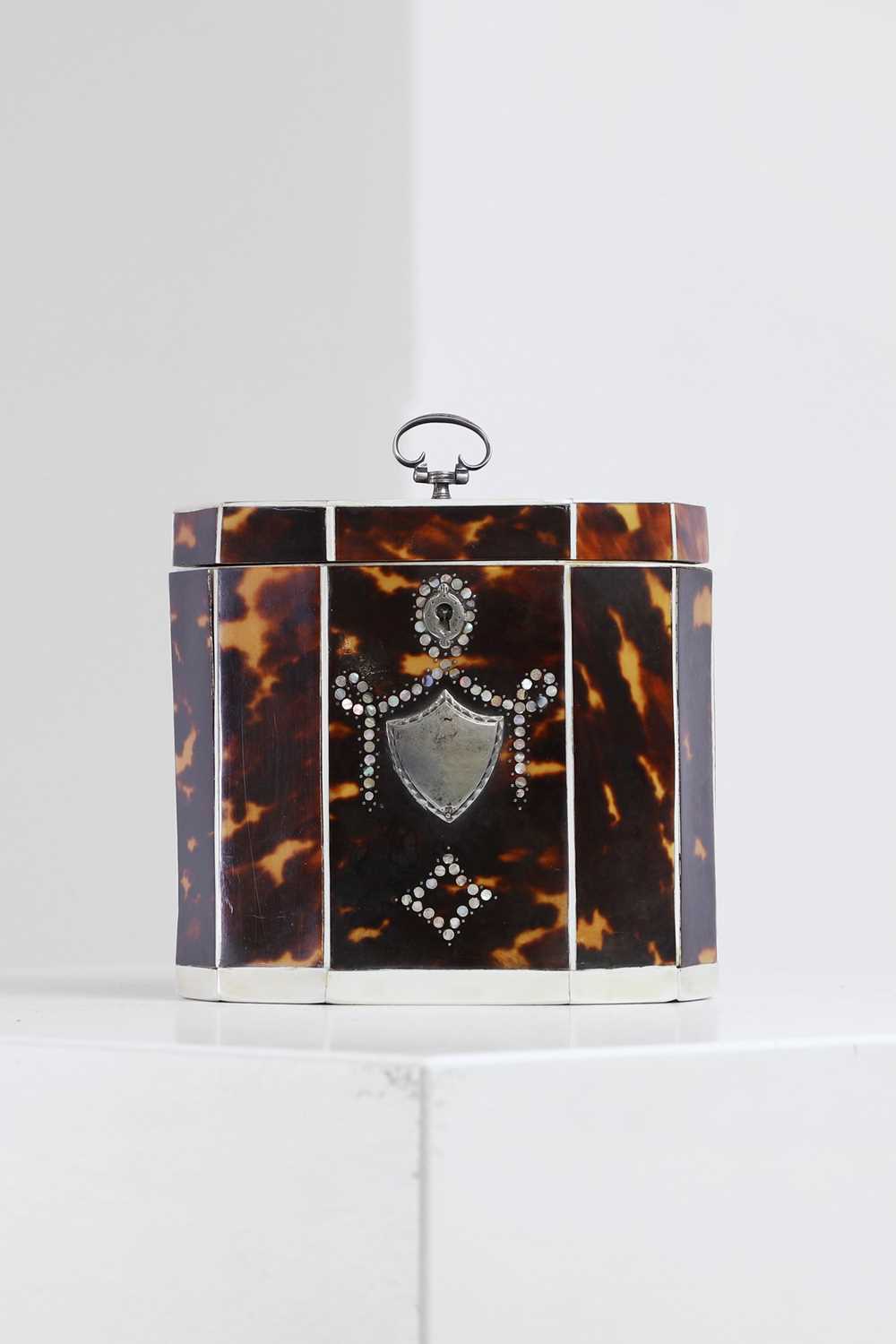 Lot 388 - A George III tortoiseshell, ivory and mother-of-pearl inlaid tea caddy