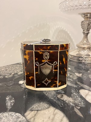 Lot 388 - A George III tortoiseshell, ivory and mother-of-pearl inlaid tea caddy