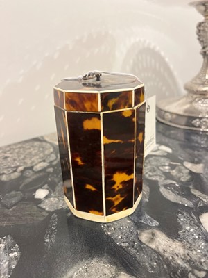 Lot 388 - A George III tortoiseshell, ivory and mother-of-pearl inlaid tea caddy