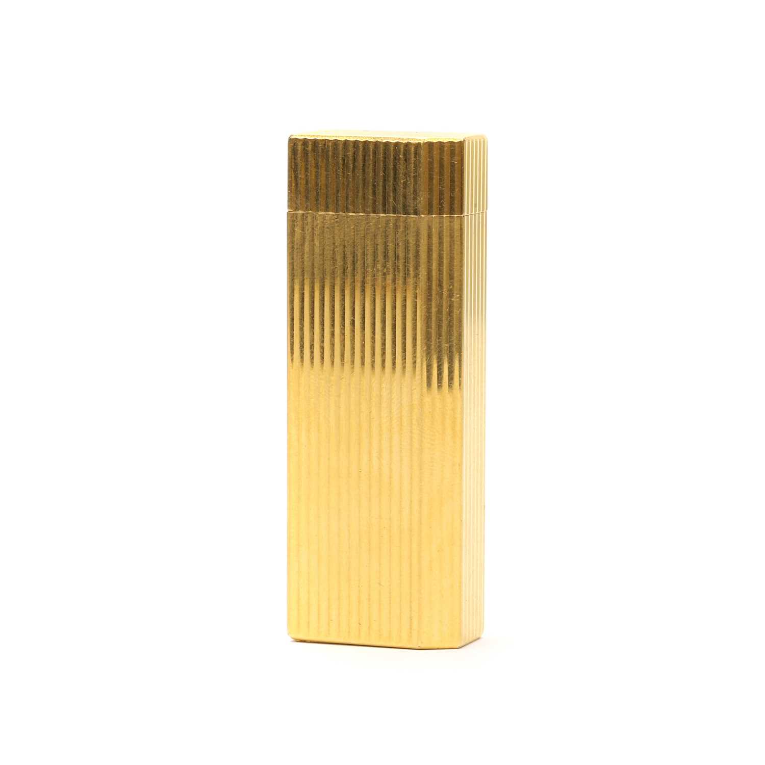 Lot 1327 - A gold plated lighter, by Cartier