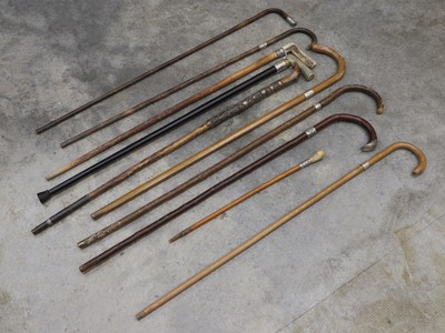 Lot 304 - A collection of silver mounted walking sticks and canes