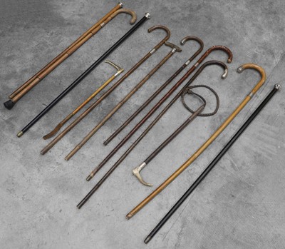 Lot 305 - A collection of silver mounted walking sticks