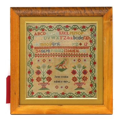 Lot 411 - A needlework sampler