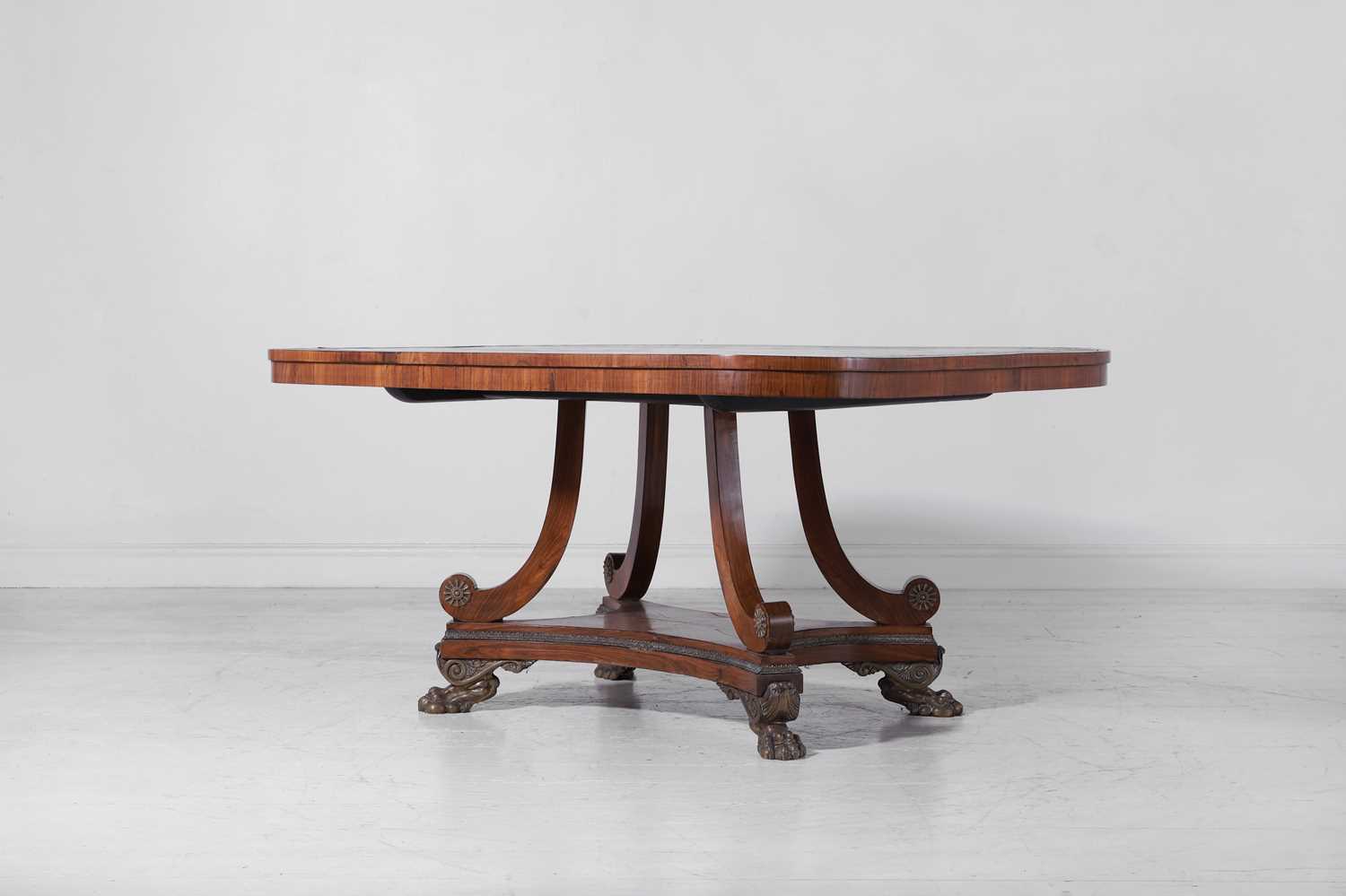 Lot 245 - A Regency kingwood and brass centre table