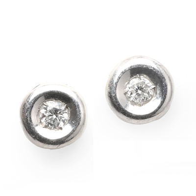 Lot 1047 - A pair of 18ct white gold diamond stud earrings
