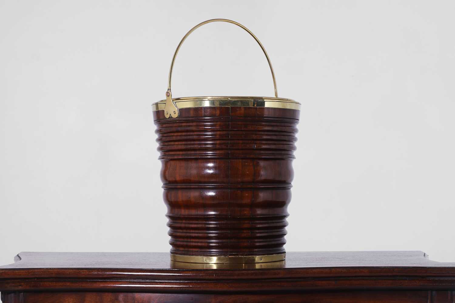 Lot 250 - A mahogany and brass peat bucket