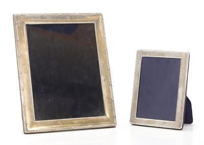 Lot 14 - A graduated near pair of silver photography frames
