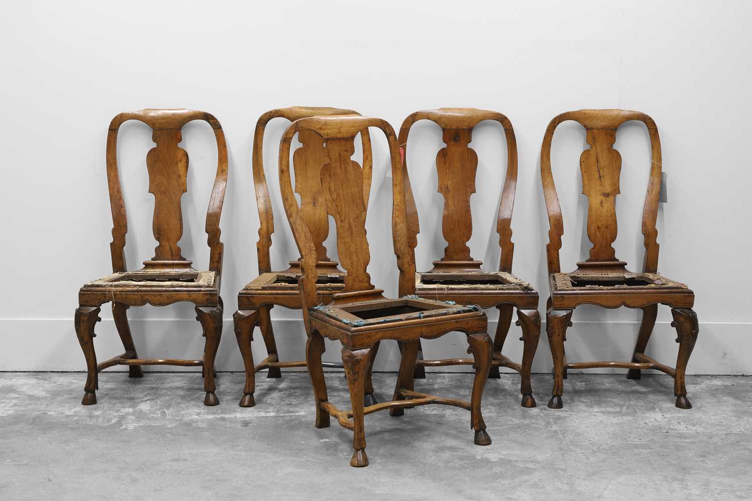 Lot 511 - A set of five George I/II walnut chairs